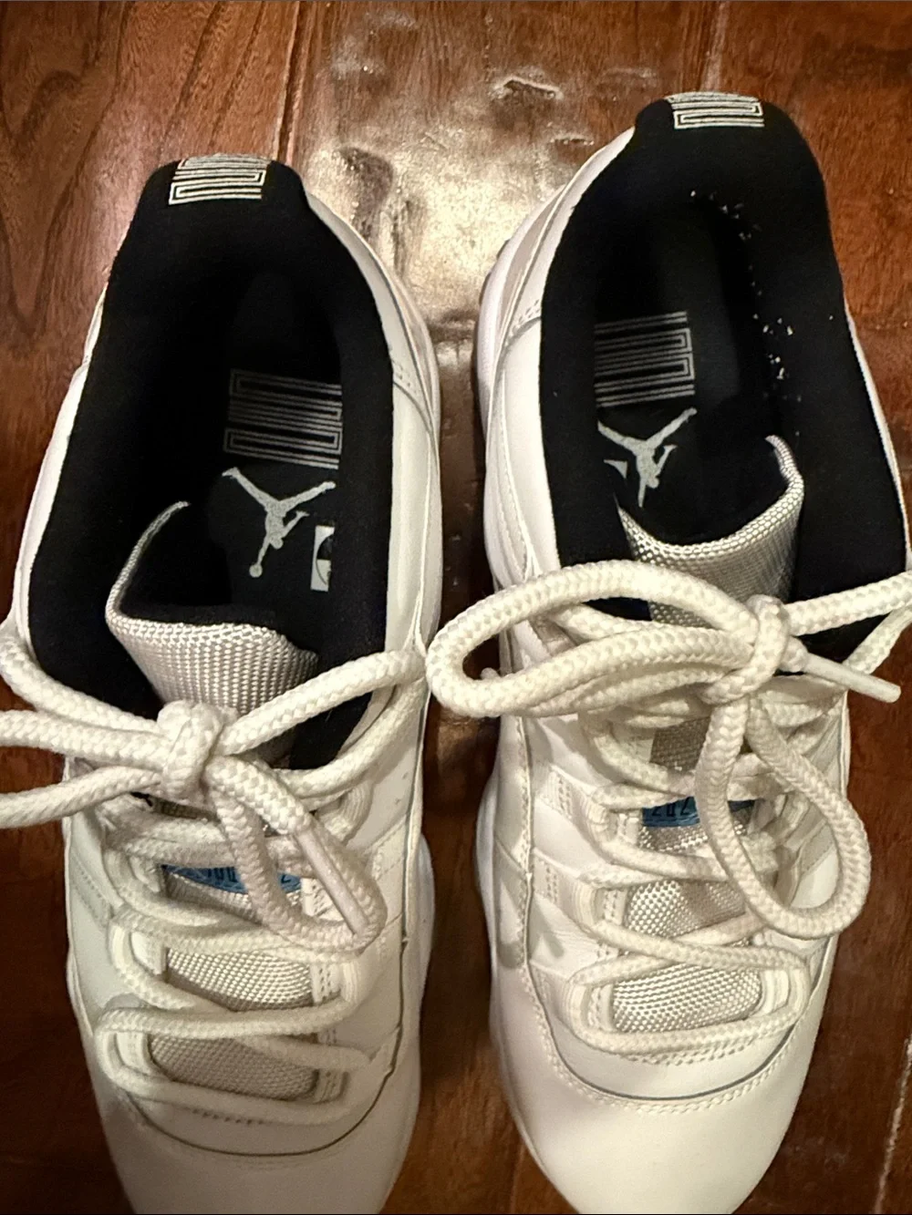 Jordan Men's White and Black Low-Top Sneakers with Blue Tongue Accent